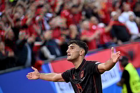 Qazim Laci celebrates after scoring the opening goal against Croataia